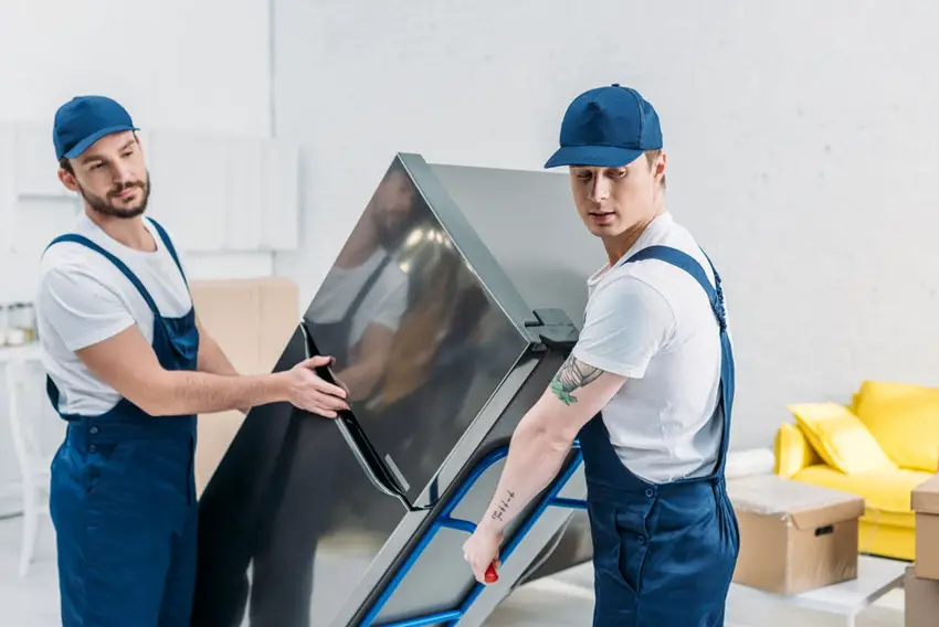 Movers with Refrigerator on a hand truck